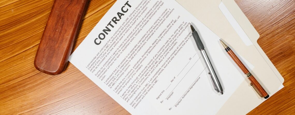 Photo of an employment contract on a wooden table