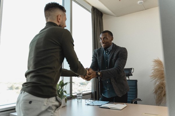 Employer shaking hands with a prospect employee