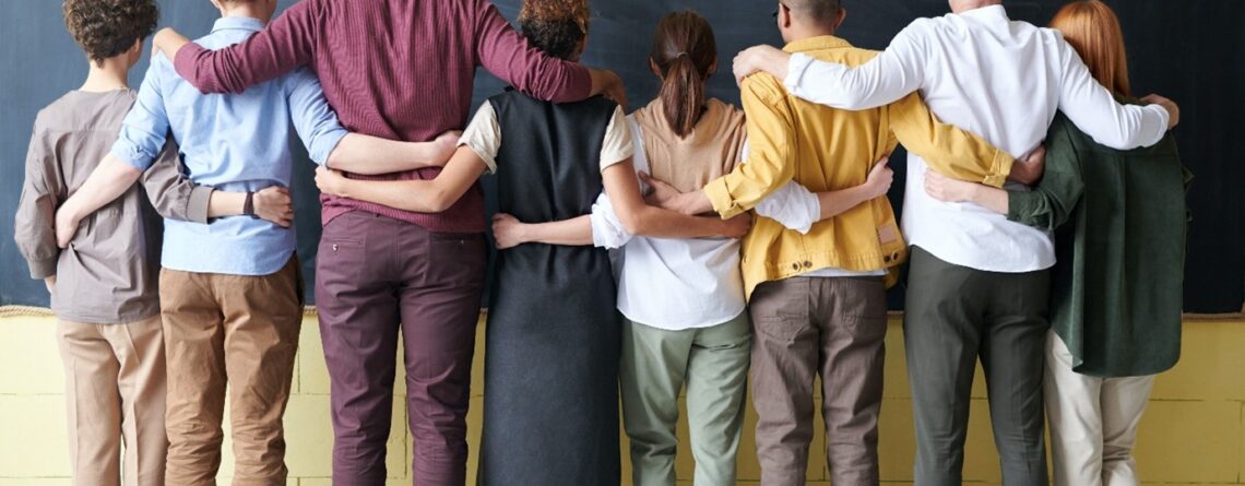 A group of people standing indoors