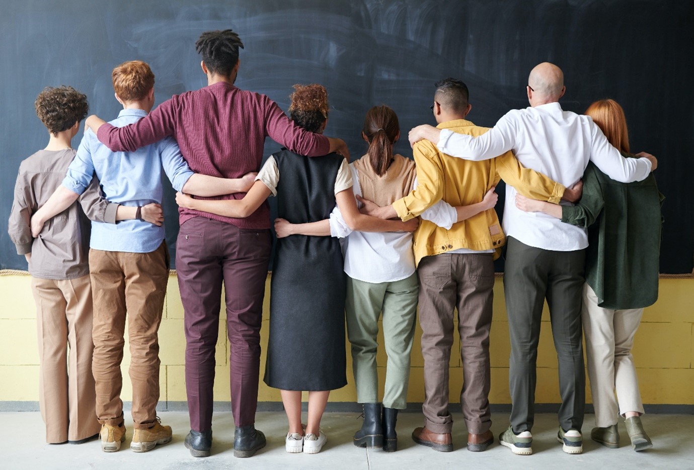 A group of people standing indoors