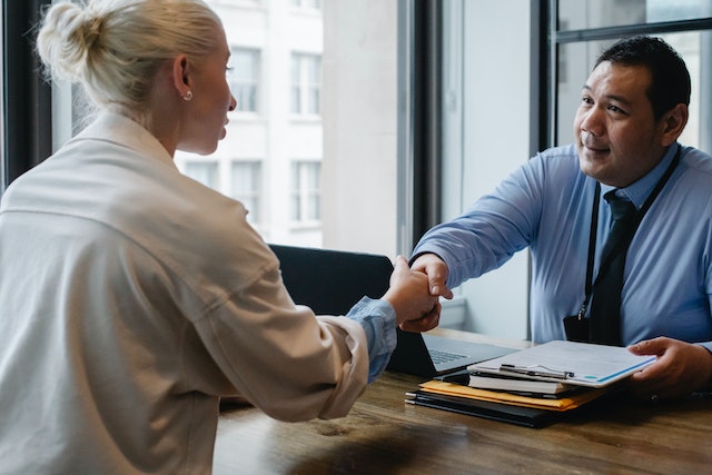 An interviewer going over a resume